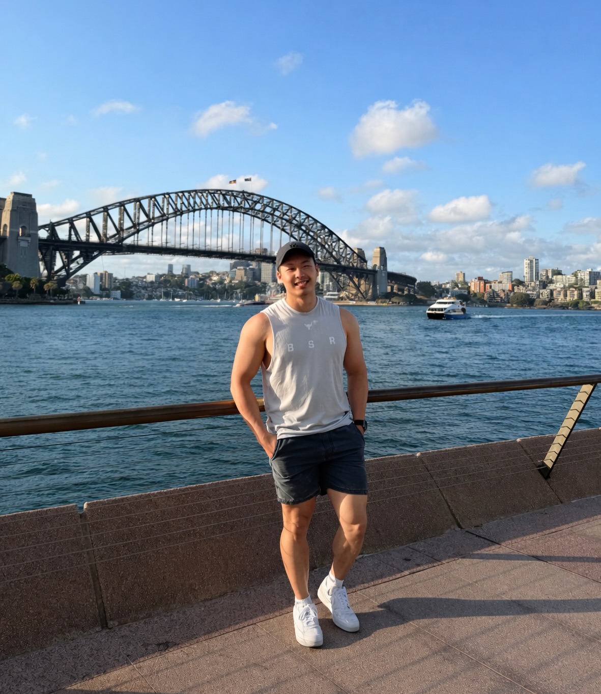 Andy beside Sydney Harbour with the Harbour Bridge behind him